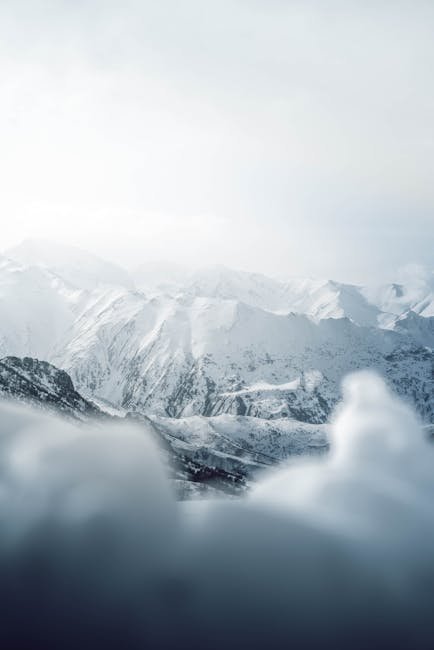 Mountain Landscapes - Breathtaking view of a snowy mountain range unde #11262381
