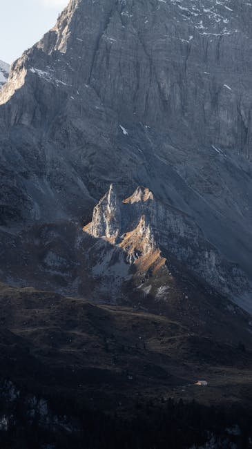 Mountain Landscapes - A stunning view of rugged mountain peaks with su #14699770