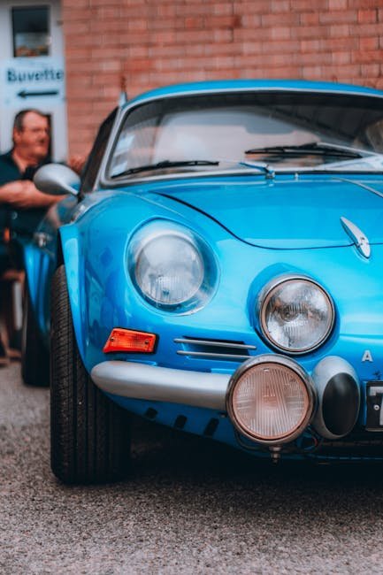 Luxury Cars - A classic blue sports car with a striking front #33285093