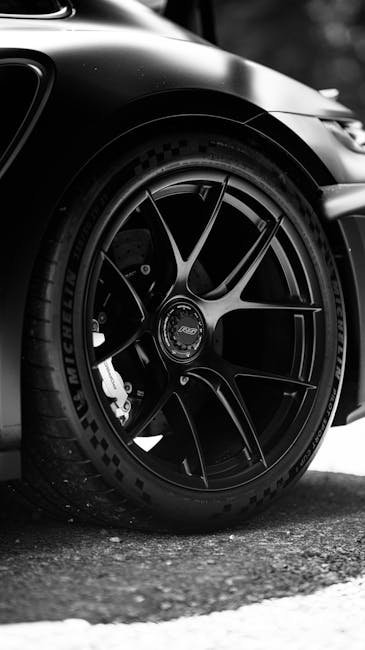Luxury Cars - Black and white close-up of a sleek sports car w #34285245
