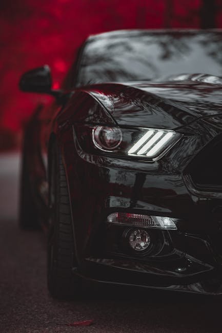 Luxury Cars - Close-up of a black luxury car with striking hea #6584051